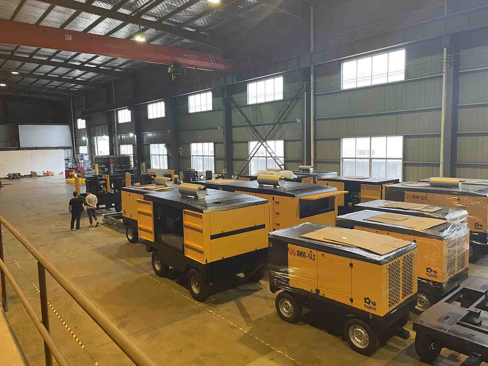 Portable compressor units arranged in a workshop.