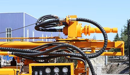 DR-140T rotary head, carriage, guide rails and connected hydraulic hoses