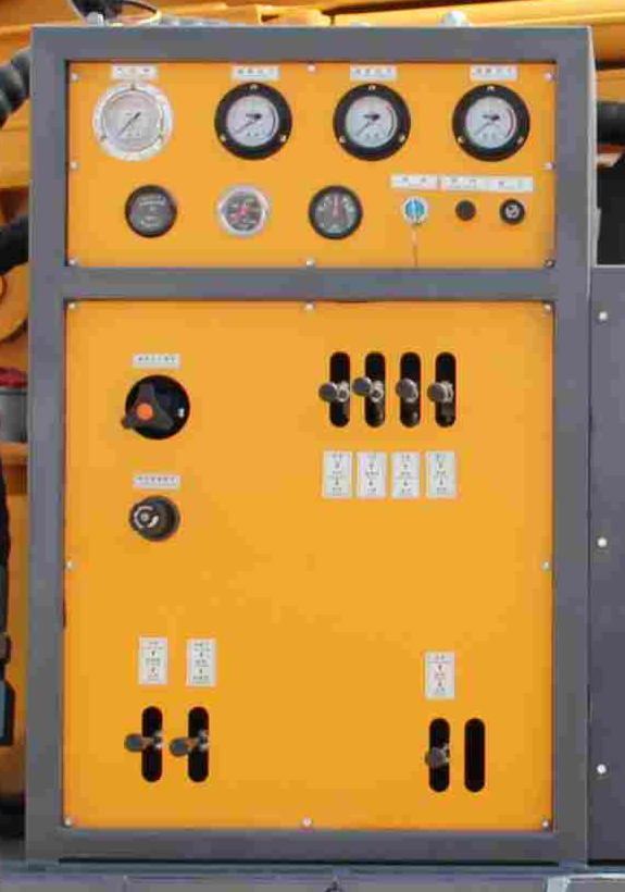 DRW200 water well drilling rig control console with gauges and operating levers